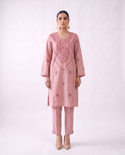 Blush pink embroidered kurta set, standing modern pose