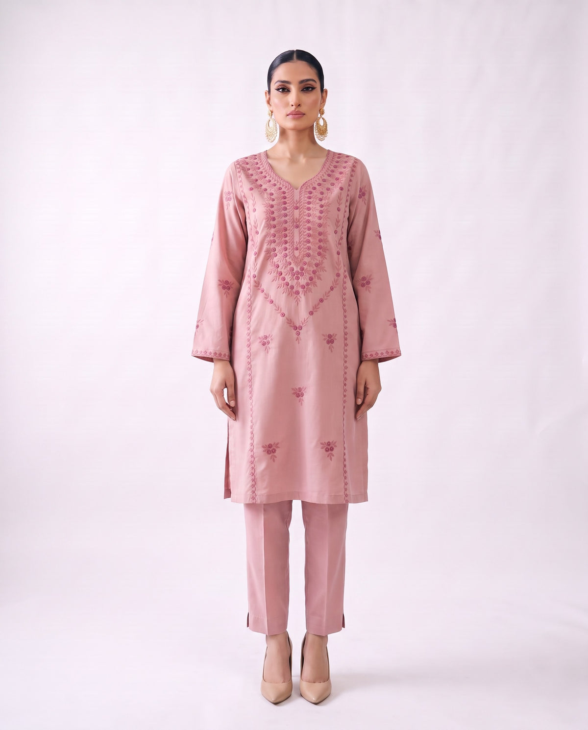 Blush pink embroidered kurta set, standing modern pose