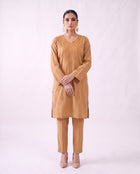 Camel gold embroidered kurta set, standing modern pose