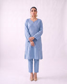 Cornflower blue embroidered kurta set, standing modern pose