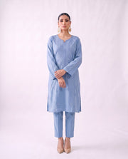 Cornflower blue embroidered kurta set, standing modern pose