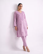 Lavender embroidered kurta set, standing modern pose