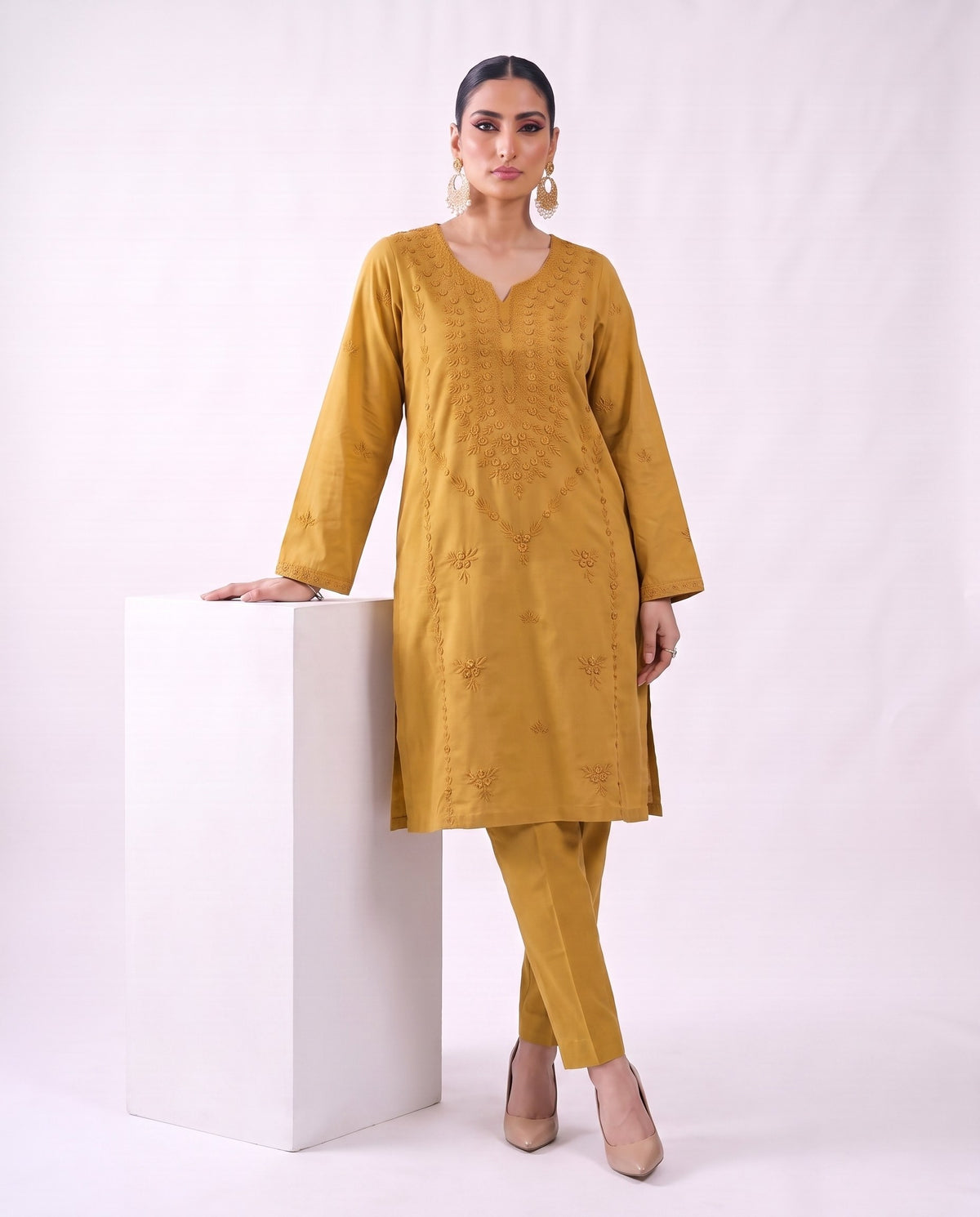 Ochre gold embroidered kurta set, standing modern pose