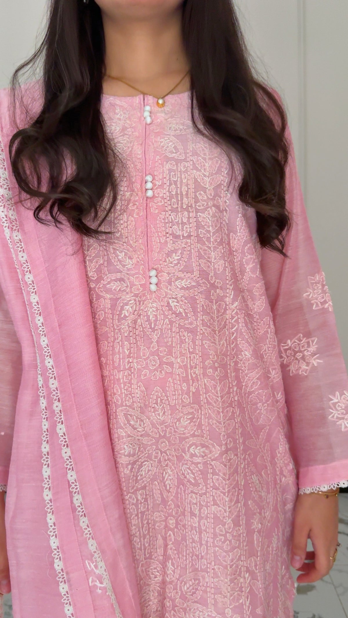 Pink chikankari embroidery texture close-up