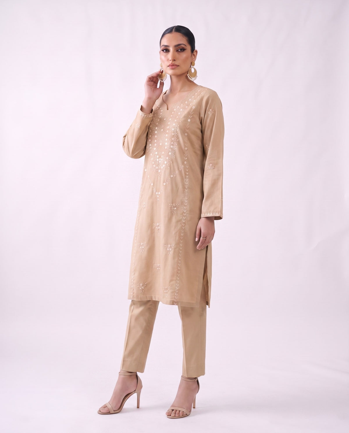 Sand beige embroidered kurta set, standing modern pose